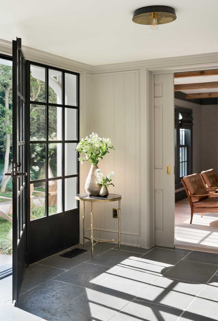 renovated farmhouse black door via remodelista