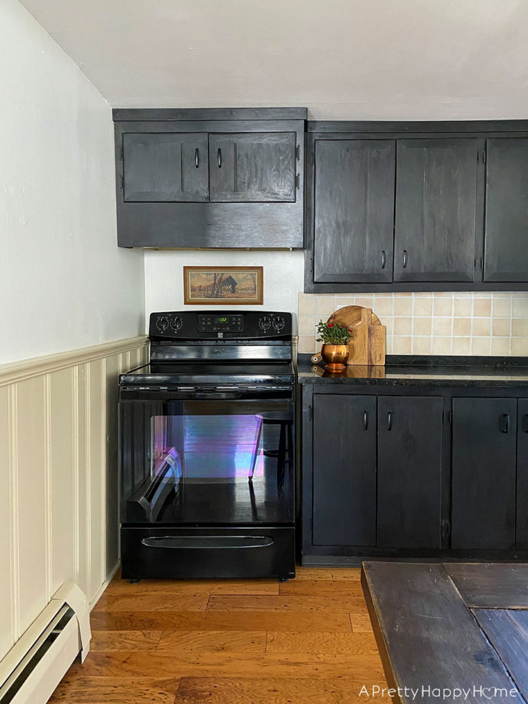 farmhouse black kitchen with landscape art kitchen art