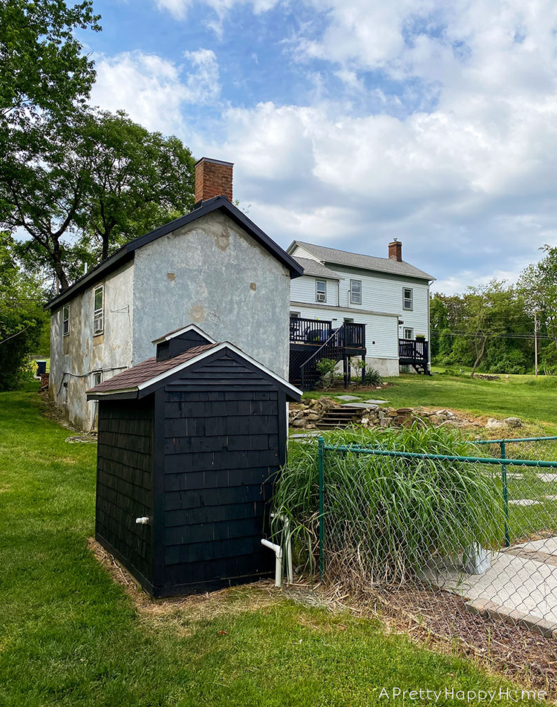 shed makeover with black stain