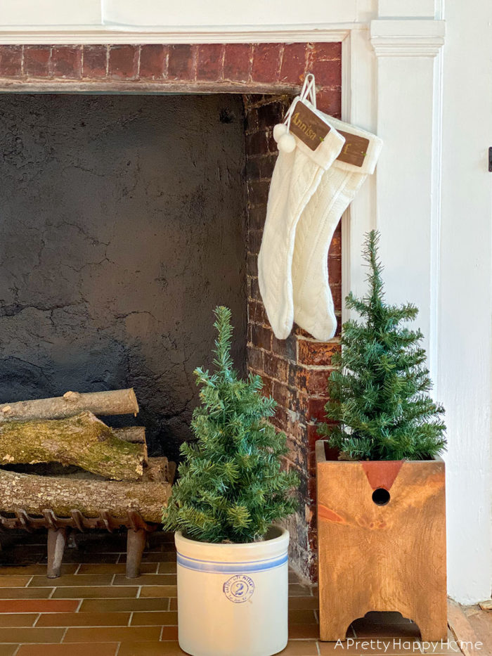 brown kraft paper snowflake mantel tree in a ceramic crock