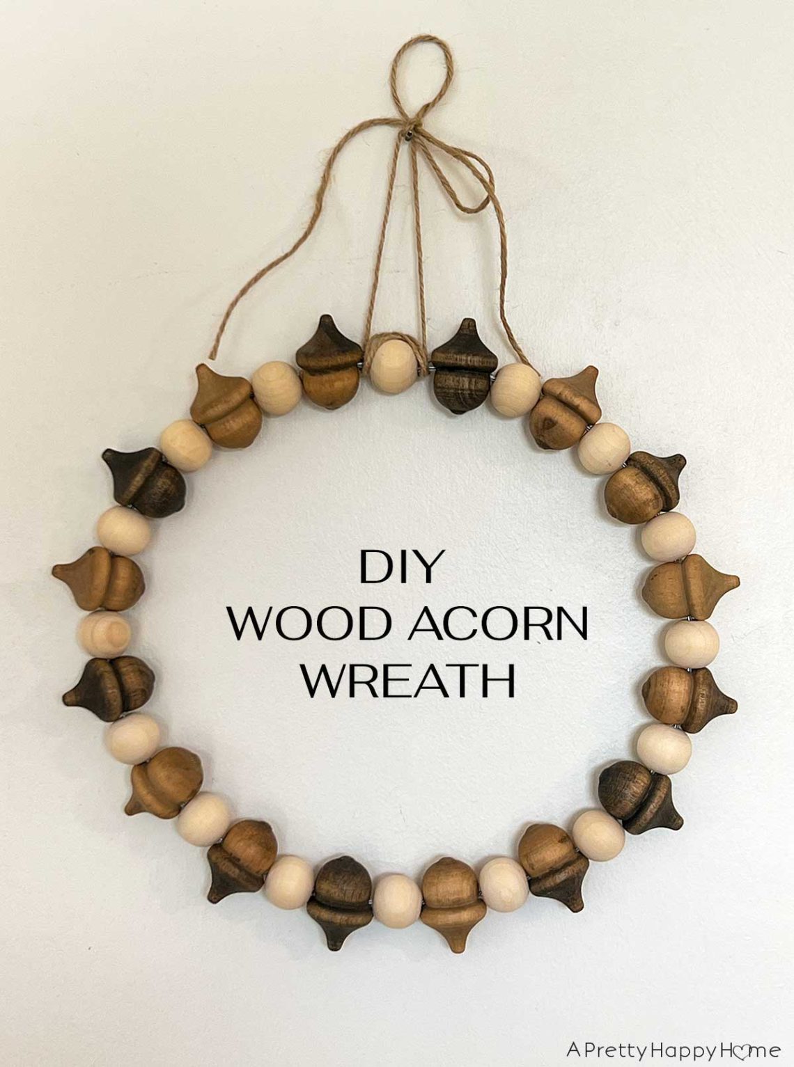 diy wood acorn wreath using wood acrons, wood beads, and wire fall wreath