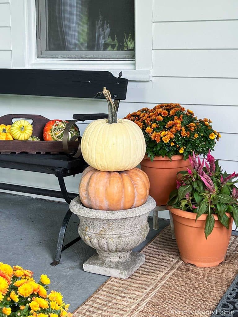 fall front porch with pumpkin topiary on the happy list