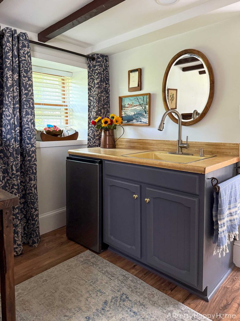 blue and white curtains in an old carriage house kitchenette