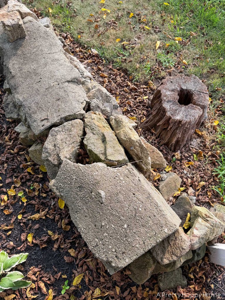 BEFORE DIY low curved fieldstone wall the plan to fix it ourselves with lime mortar