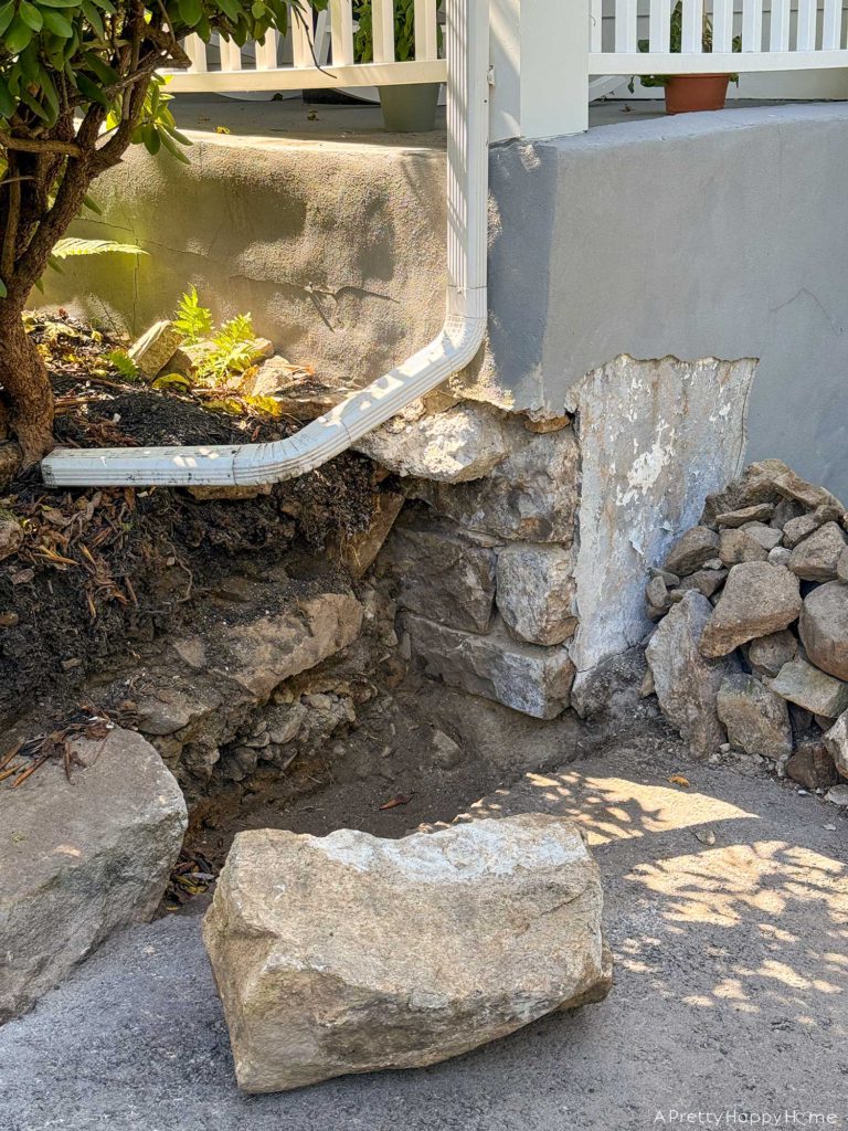 diy curved fieldstone wall demoing the old wall on a colonial era farmhouse