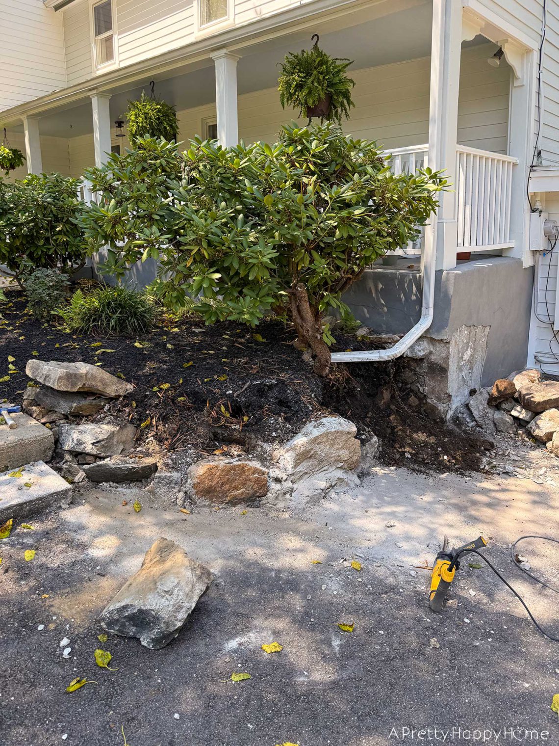 diy curved fieldstone wall demoing the old wall on a colonial era farmhouse
