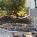 diy curved fieldstone wall with lime mortar and natural fieldstone in progress