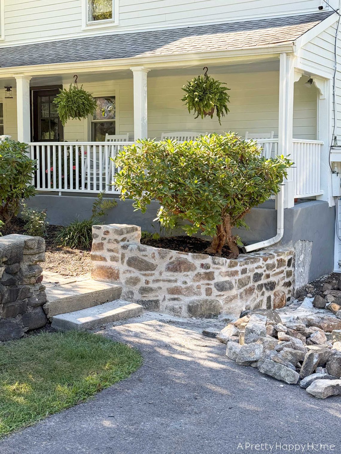 newly rebuilt curved fieldstone wall using lime mortar and natural fieldstone