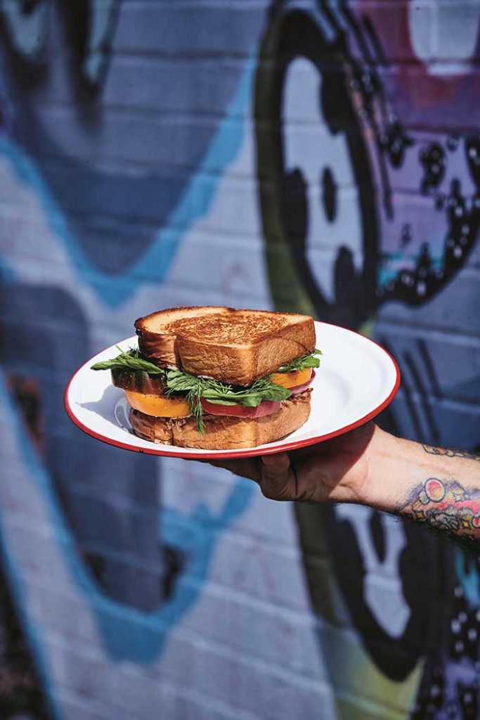 tomato sandwich with sunflower seeds by mason hereford photo by william hereford via garden and gun on the happy list