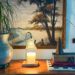 candle warmer lamps sitting on a table in front of a gallery wall great christmas gift idea 2025