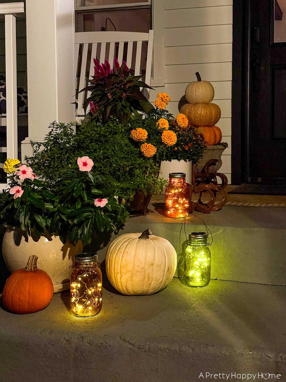 fall front porch with colored solar lanterns