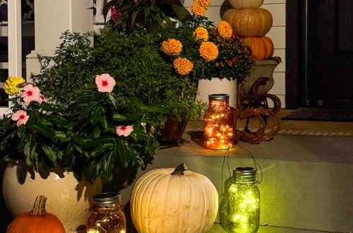 fall front porch with colored solar lanterns