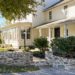 DIY curved fieldstone wall using historic masonry techniques and all fieldstone and lime mortar