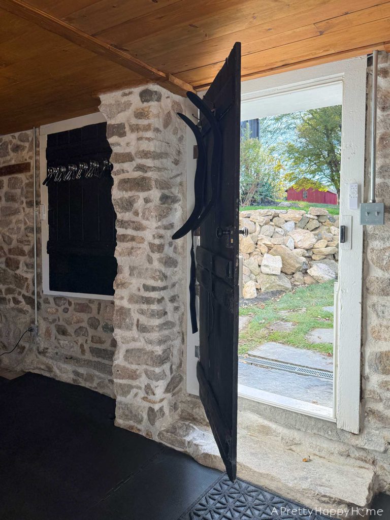 converting a door to a window in a stone building with a stone foundation