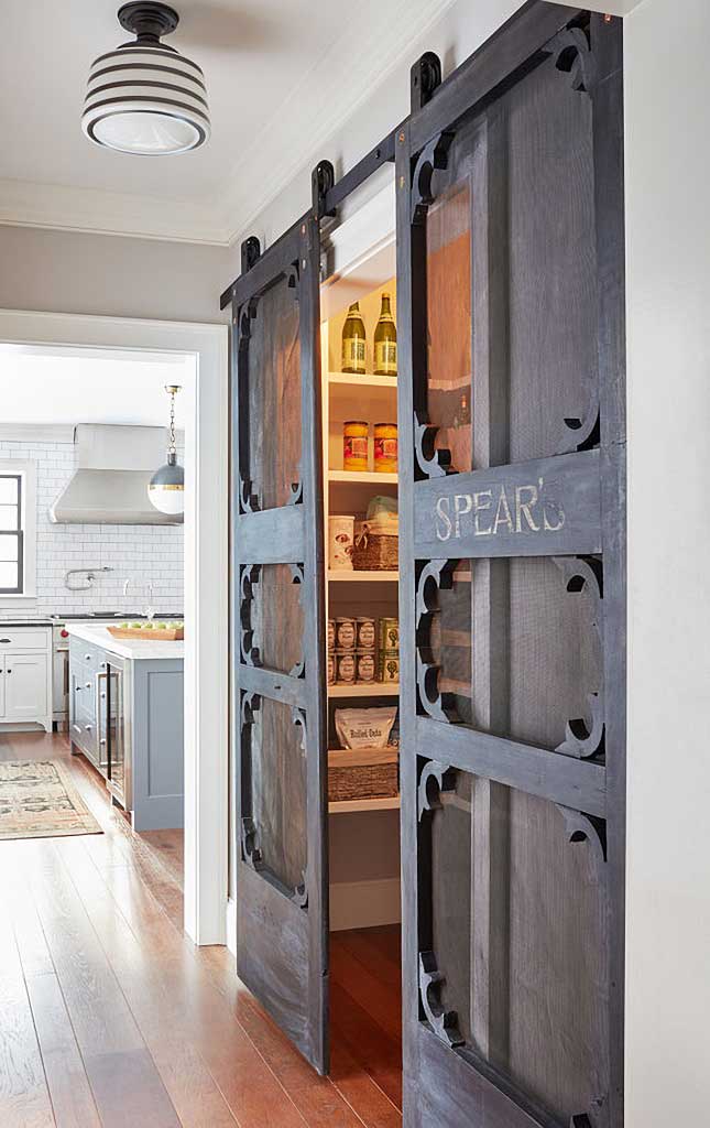 farmhouse kitchen with barn door over pantry by Kristina Crestin Design via town n county living on the happy list