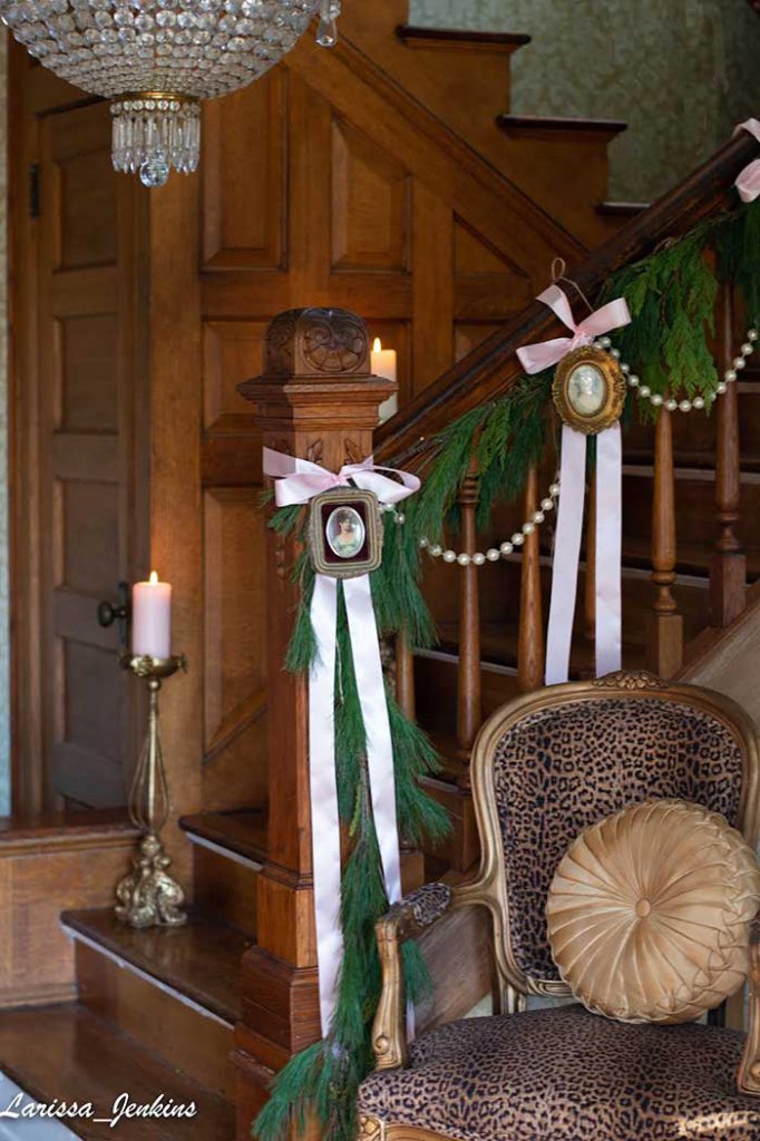 photo garland for christmas staircase in antique frames from larissa jenkins of welch house 1900 on the happy list