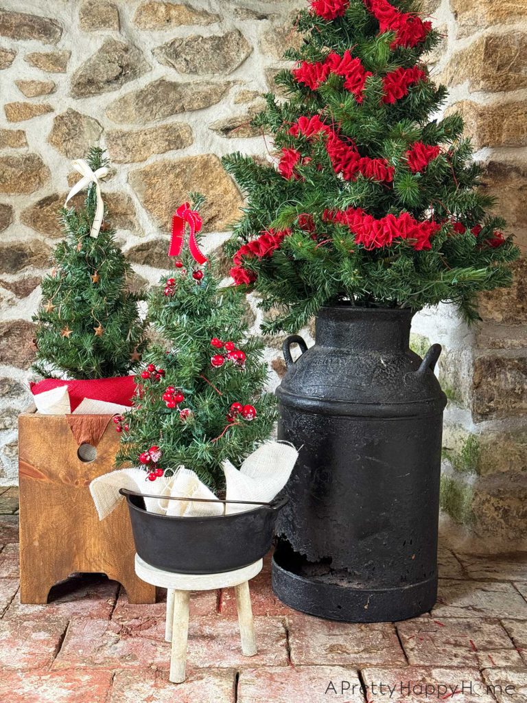 rustic carriage house christmas rustic stone fireplace decorated for christmas using a milkman and a dutch oven as christmas tree stands