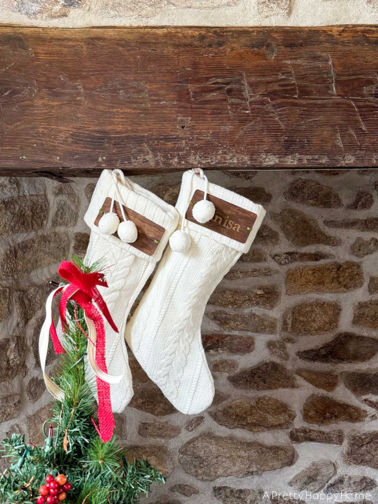 rustic carriage house christmas rustic stone fireplace decorated for christmas using white christmas stockings