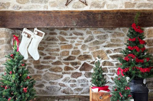 rustic carriage house christmas rustic stone fireplace decorated for christmas