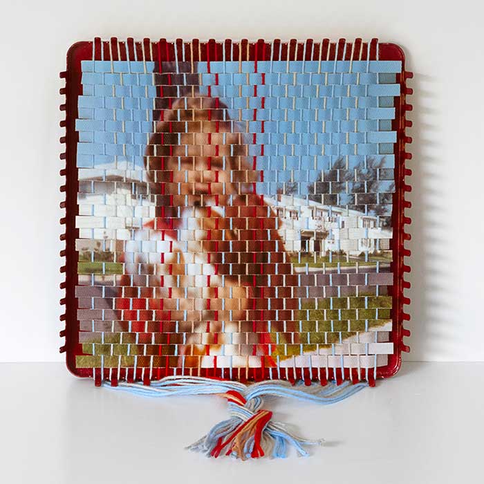 vintage photo of a young girl with dark hair standing in front of light colored house that is woven onto a vintage potholder loom by artist pam connolly and featured at this is colossal