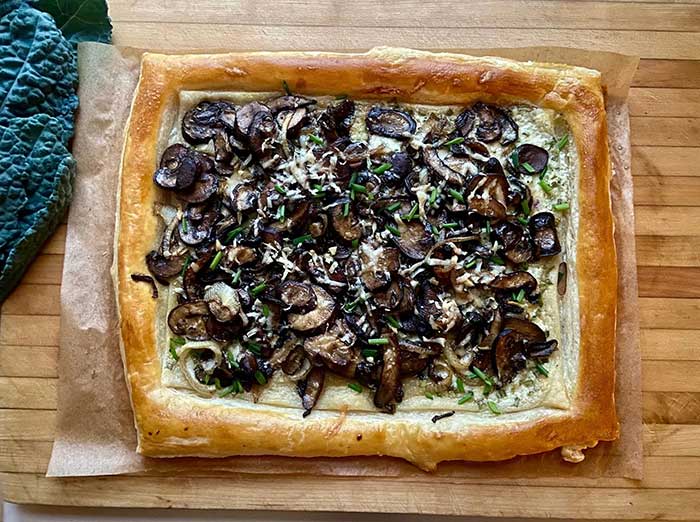 picture of a mushroom tart in puff pastry recipe by jenny rosenstrach and featured at Cup of Jo. Shown here on the happy l ist.