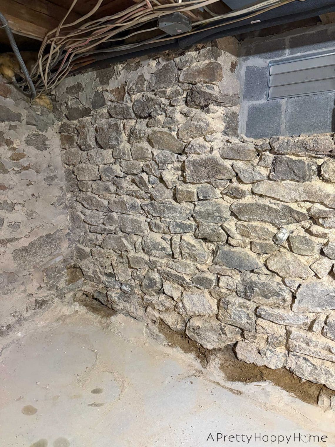stone foundation from the 1780s being chipped out and repointed with new lime mortar made from natural hydraulic lime