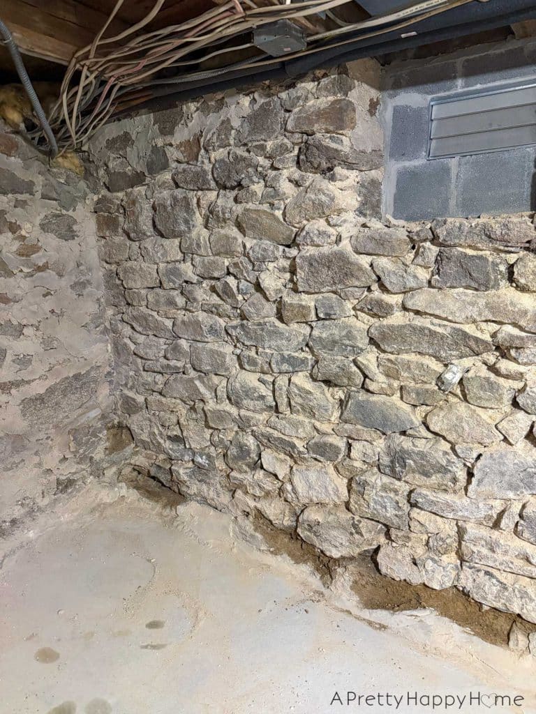 stone foundation from the 1780s being chipped out and repointed with new lime mortar made from natural hydraulic lime