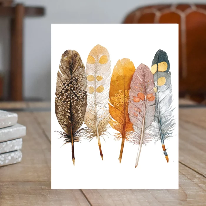 greeting cards with five watercolor feathers painted on the front from etsy shop wildwoodsfarmstudio