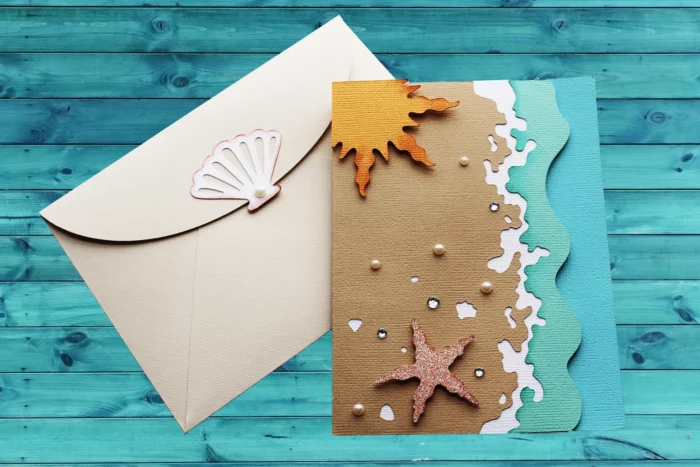 laser cut greeting card showing a vibrant beach scene from etsy shop thecardcove