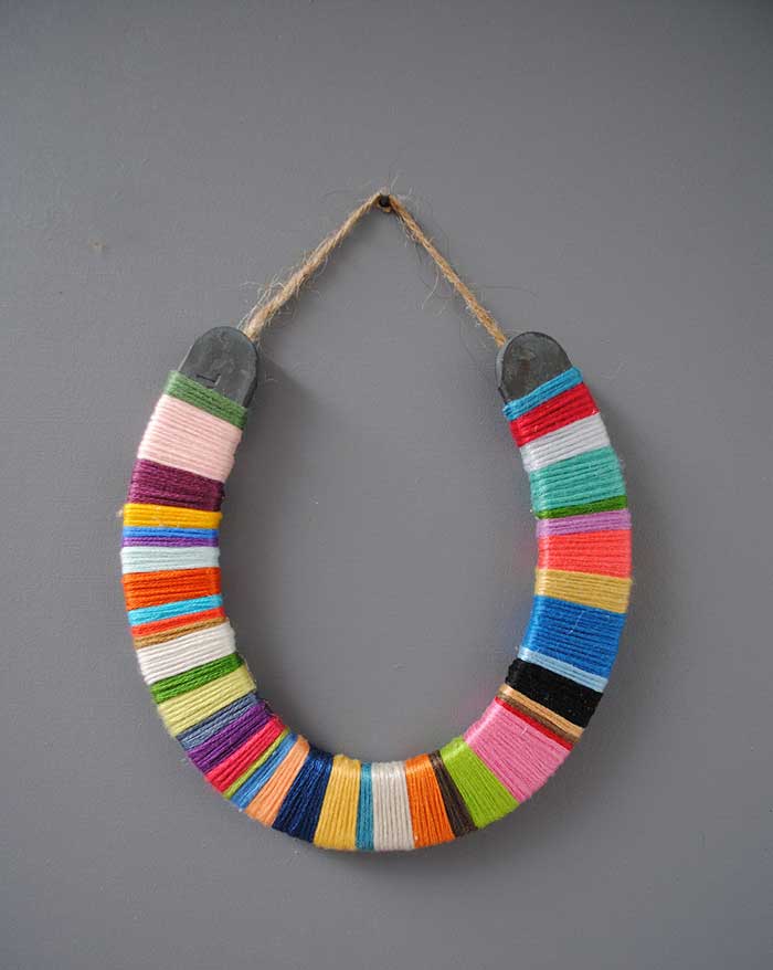 horseshoe wrapped with various colored threads by etsy shop colorstorydesigns