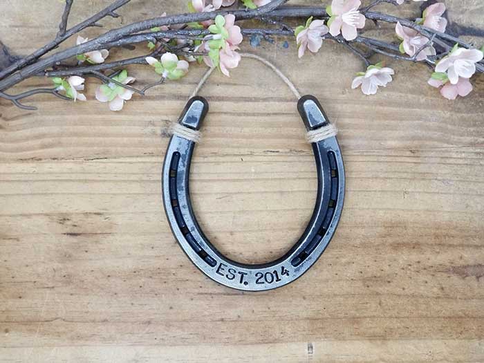 horseshoe stamped with est. 2014 and can be personalized with different date by etsy shop LuckyAmericanDesigns