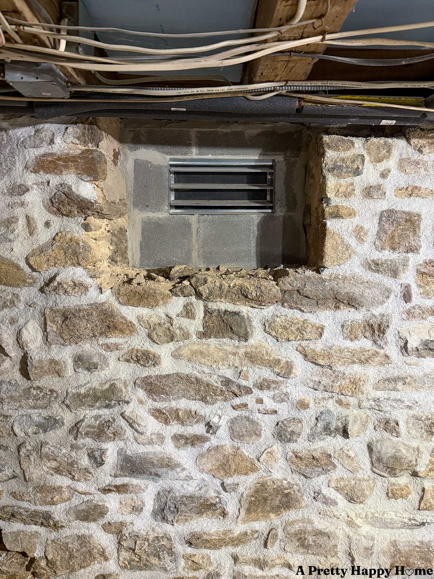 stone foundation n the process of being repointed but the cinderblock opening in the wall is not supporting the floor joists above it adequately and remedies must be made
