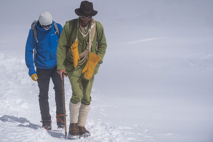 turner twins traipsing through the snow. One twin wears modern arctic gear. The other twin wears arctic gear from 1914. Via Cardiology