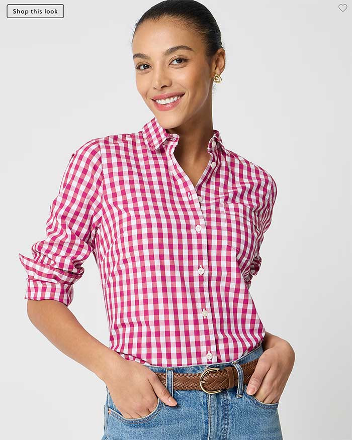 woman wearing a red gingham button up shirt from JCrew with jeans and a brown belt