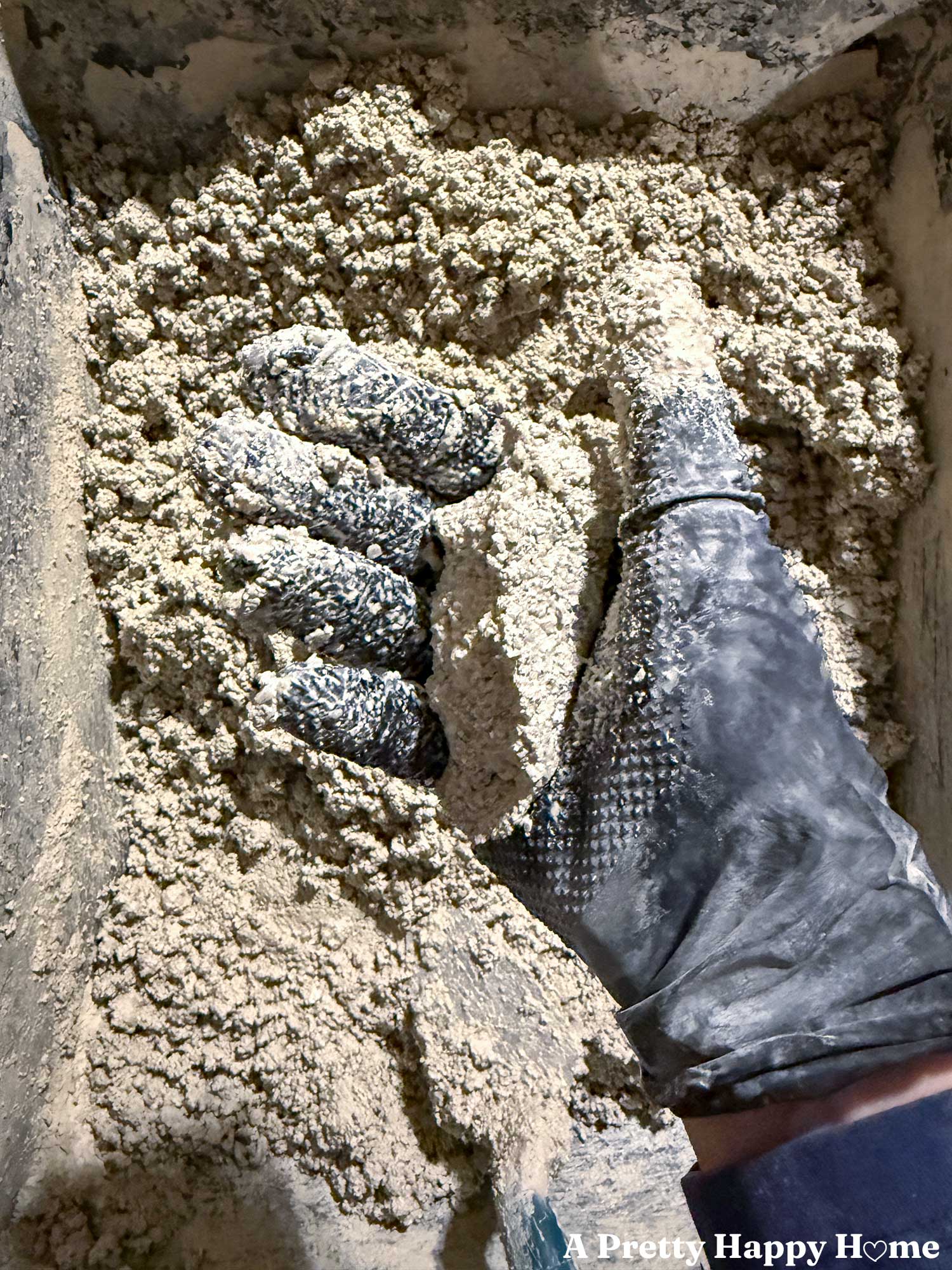 mix lime mortar made with natural hydraulic lime NHL with sharp sand and water until it holds together when you grab it in your fist