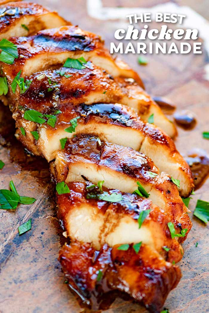 marinated, grilled, and sliced chicken breast with green parsley sprinkled over the top