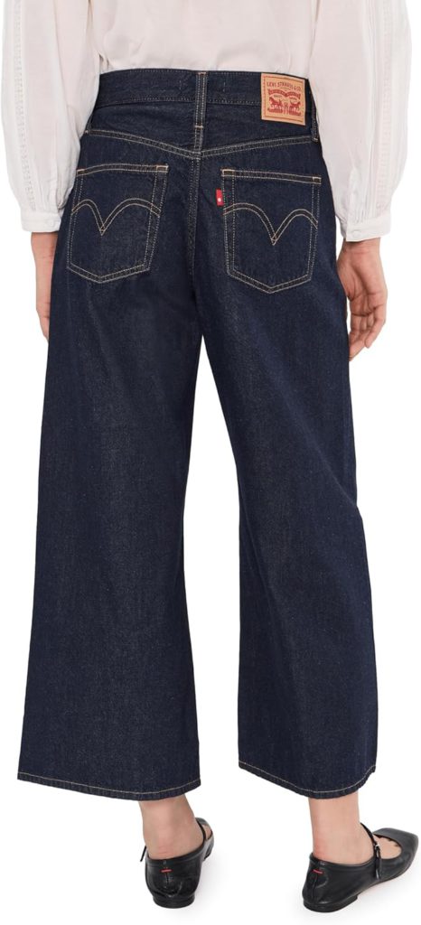 model wearing levis dark wash middy wide leg ankle jeans