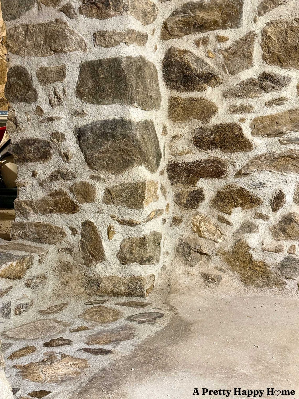 newly repointed fieldstone foundation walls and step in a 1780s home