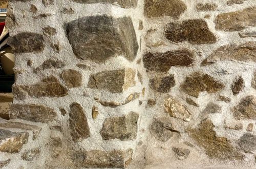 newly repointed fieldstone foundation walls and step in a 1780s home