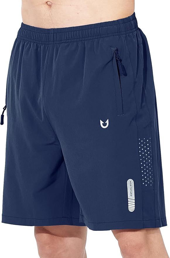man wearing northward athletic shorts in the color blue