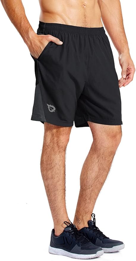 man wearing black bayleaf shorts with black tennis shoes