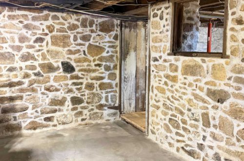 Newly repointed stone walls in a 1780s home with a stone foundation using lime mortar mixed with natural hydraulic lime