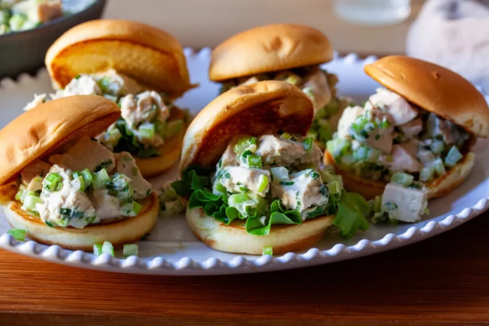 chicken salad on toasted buns and butter lettuce on a platter recipe by smitten kitchen