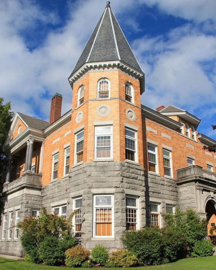 haskell free library that straddles the boundary between the US and Canada. it's a picturesque brick and stone building with a turret