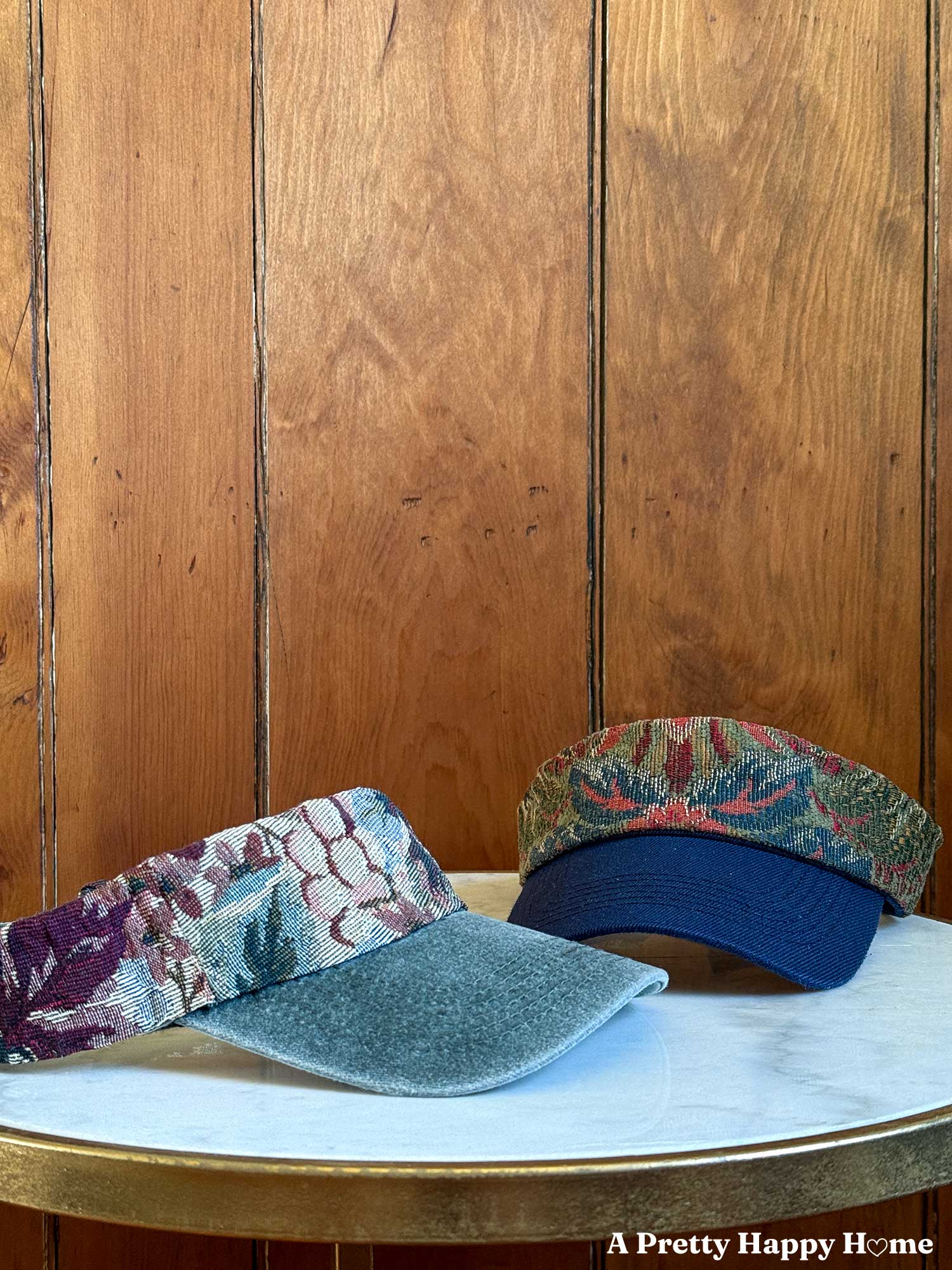 two visors, one green, one blue, customized with jacquard fabric on the headbands.