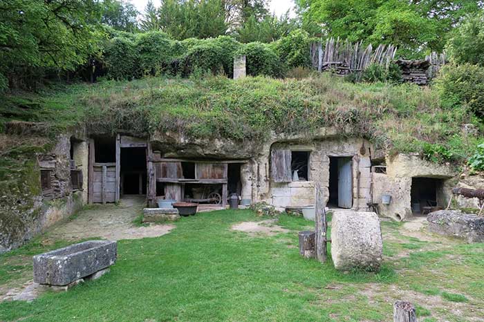 troglodyte village built in into the mountain in france's loire valley