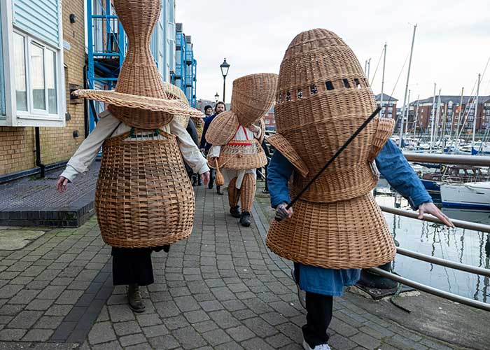 Absurdist basketweaver Lewis Prosser's basket costumes worn by participants in a cultural celebration