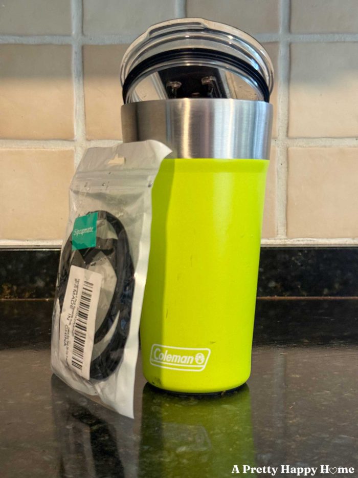 bright yellow coleman tumbler with package of new rubber lid gaskets made for a Yeti 20 oz because those fit the coleman 20 oz tumblers.